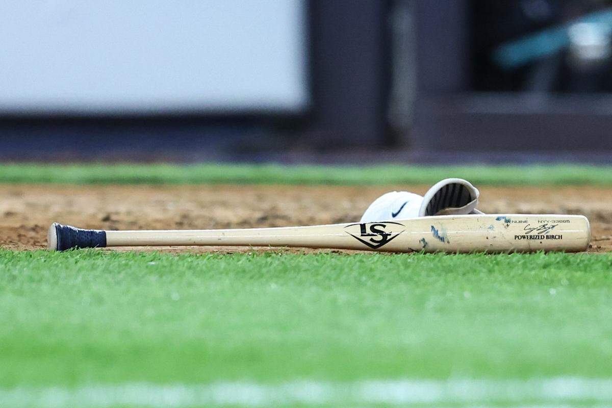 Apr 1, 2025; Bronx, New York, USA;  A torpedo bat belonging to New York Yankees center fielder Cody Bellinger (35) lays on the field in the fifth inning against the Arizona Diamondbacks at Yankee Stadium. Mandatory Credit: Wendell Cruz-Imagn Images