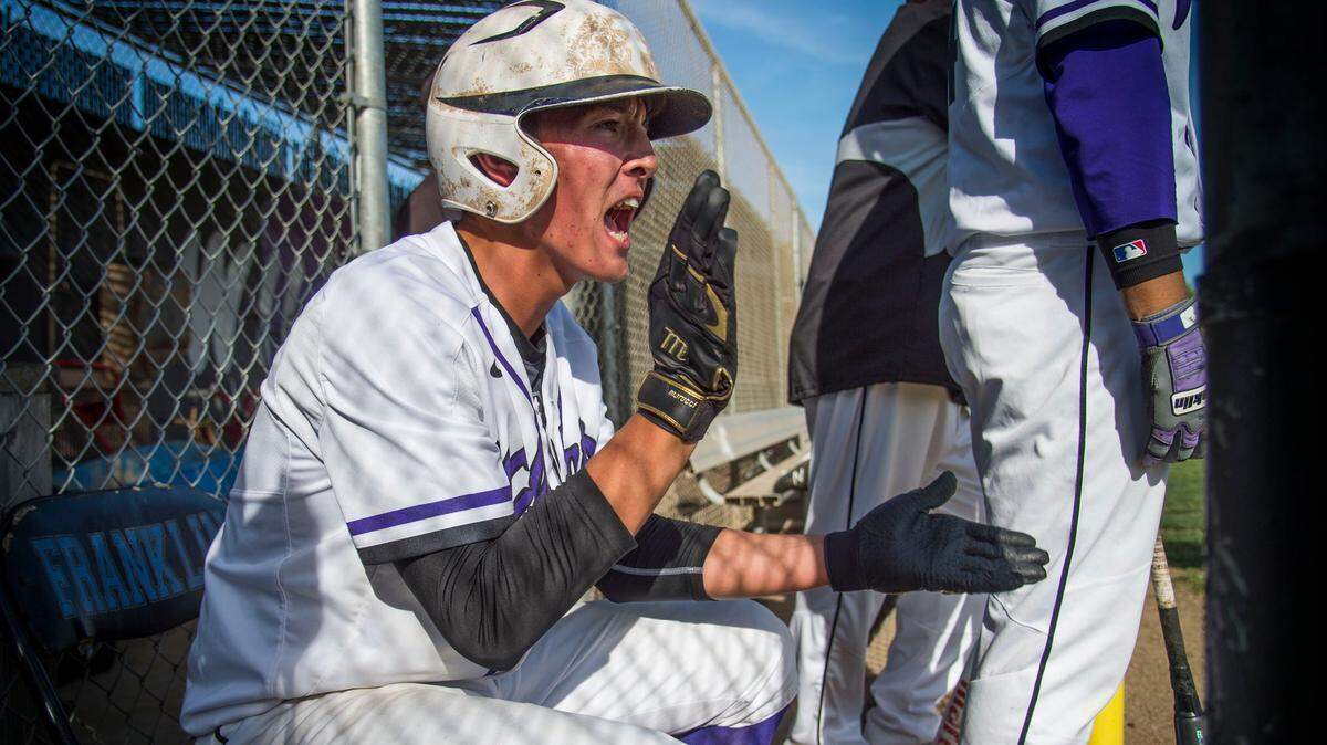 Evan Gibbons of Franklin High School cheers on his team against Davis High School. The Sac State commit started the season with a 15-strikeout perfect game and also has a win over top-ranked Elk Grove. He's a team leader and a leader on campus.