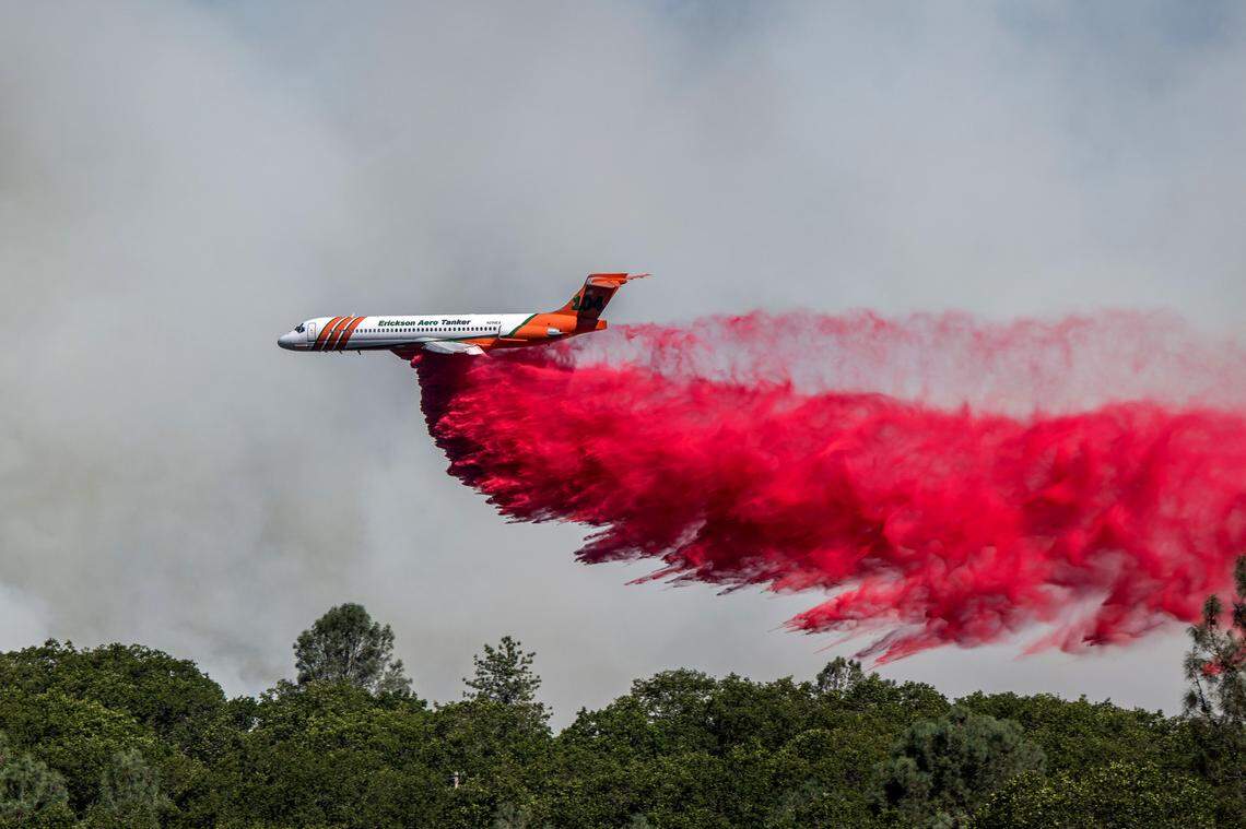 An Erickson Aero Tanker drops retardant on the Park Fire near Cohasset Road east of Chico on Thursday.