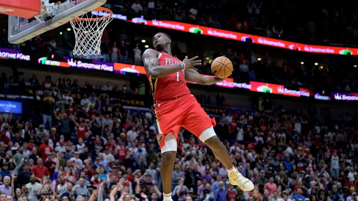 New Orleans Pelicans forward Zion Williamson (1) goes up to dunk against the Phoenix Suns in the second half of an NBA basketball game in New Orleans, Friday, Dec. 9, 2022. (AP Photo/Matthew Hinton)