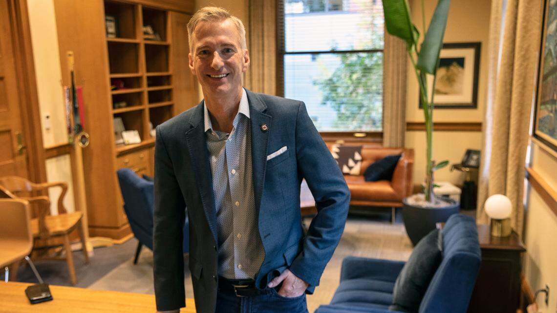 FILE - In this Oct. 9, 2020, file photo, Mayor Ted Wheeler poses in a City Hall office in Portland, Ore. Mayor Wheeler is facing Sarah Iannarone in the election on Tuesday, Nov. 3, 2020. (AP Photo/Paula Bronstein, File)