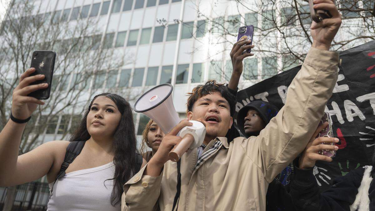 Carla Ruelas and Mark Jhohann, students at Burbank High School, lead students in a protest in front of the John E. Moss Federal Building during a protest against ICE on Friday, Jan. 30, 2026. Sacramento youth demand city noncooperation with ICE.