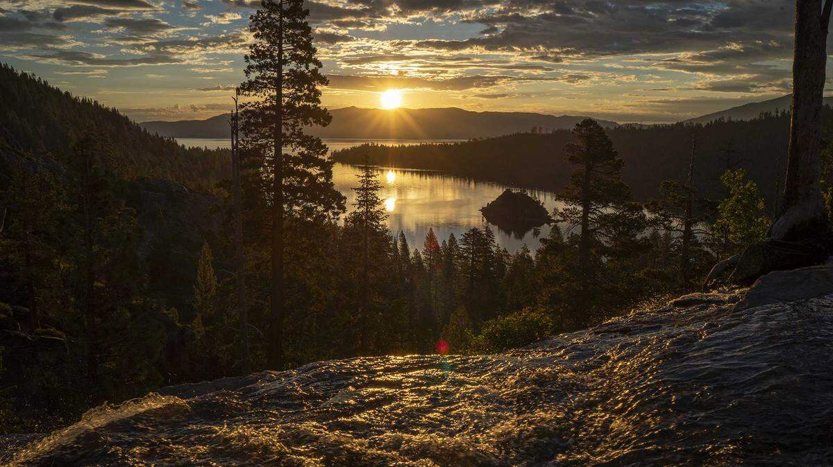 The sun comes up over Emerald Bay at Lake Tahoe in this undated photo. Scientists have launched a pilot project to âclimate-proofâ Lake Tahoeâs clarity by ridding it of tiny shrimp placed there decades ago, according to research released Thursday, Aug. 1, 2019, by UC Davis Tahoe Environmental Research Center.