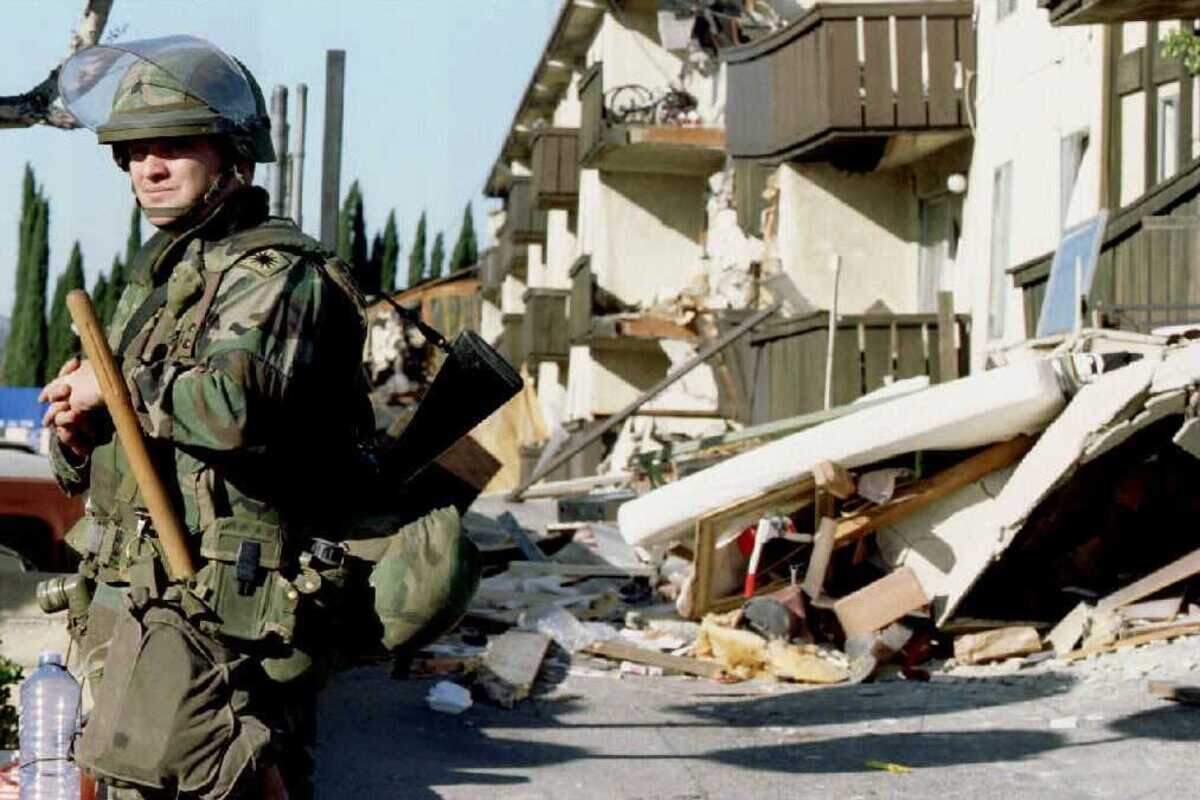 A California National Guardsman stands outside the ruins of the Northridge Meadows Apartments in the Los Angeles neighborhood after the January 1994 earthquake. The magnitude 6.7 Northridge earthquake was Southern California's last major urban earthquake, and researchers say new findings reinforce that the region remains under high levels of stress along the southern San Andreas and San Jacinto fault systems.