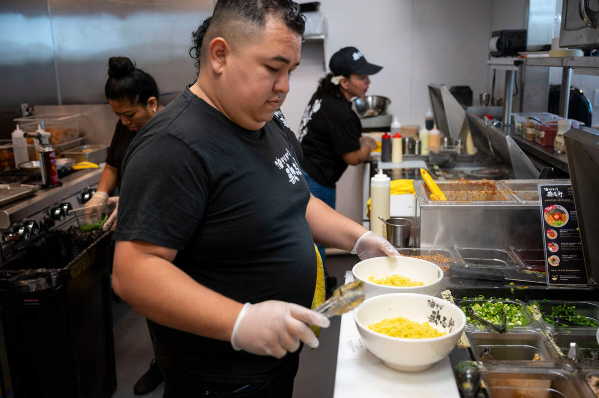 Chef Pepe prepares abura soba, Japanese noodles similar to brothless ramen, in the kitchen at Kajiken in Elk Grove on thier opening day Thursday.