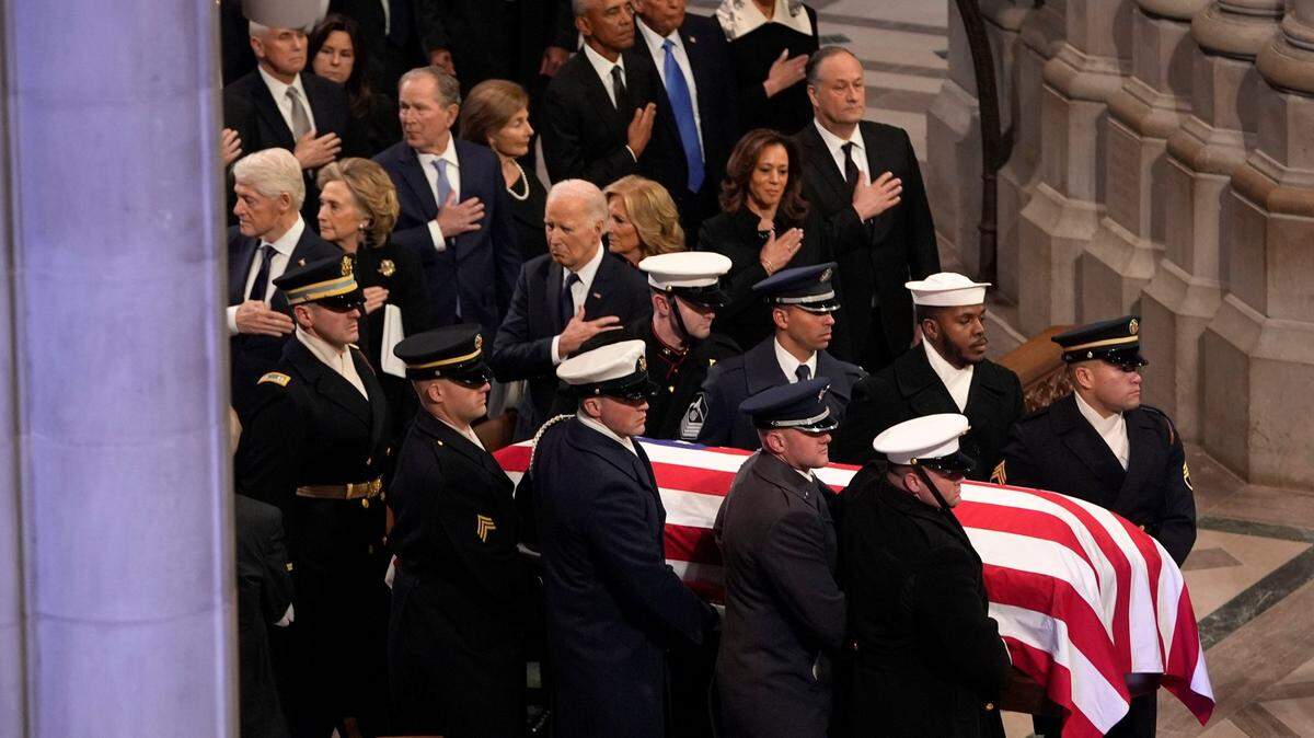 President Joe Biden, alongside President-elect Donald Trump, and former presidents George W. Bush, Bill Clinton and Barack Obama pay their respects to Jimmy Carter on Thursday.