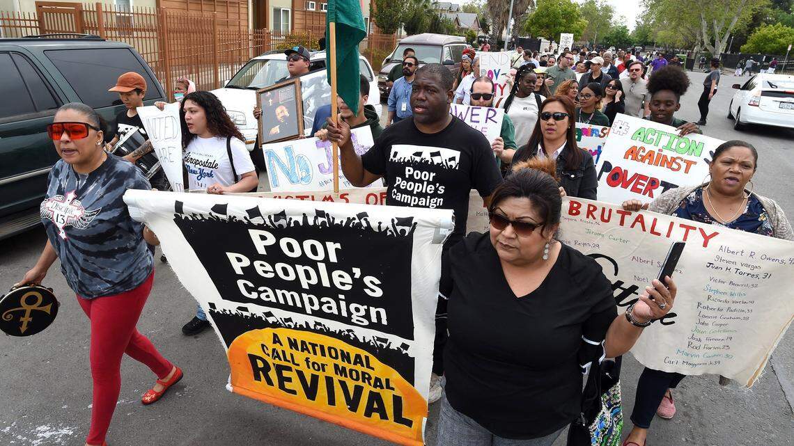 Members of the California Poor People's Campaign march on F Street near downtown Fresno to raise awareness on poverty in this April 2019 file photo. Fresno County’s low-income residents face benefit disruptions due to staff shortages; California must hire more county workers to protect basic needs.
