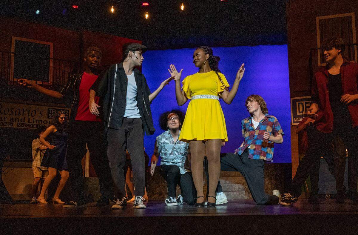 Natomas Charter School students Ali Qadiri, 18, and Genesis Crowly, 17, perform a scene from their school’s production of Lin-Manuel Miranda’s musical “In the Heights” on Wednesday.