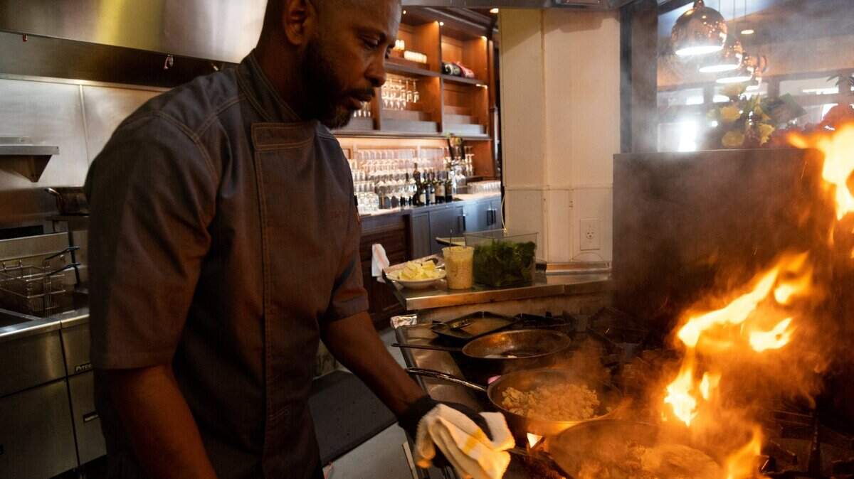 Quentin “Chef Q” Bennett makes a pan seared scallops dish with crab hash cakes, sautéed spinach and garlic beurre blanc at Q1227 restaurant in Roseville. He is one of the chefs featured at the West End Revival dinner, the main event this weekend for the Farm-to-Fork Festival.