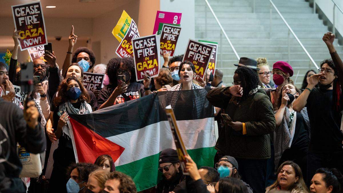 Demonstrators show support for a cease-fire in the Gaza Strip during the 2023 California Democratic Party November endorsing convention on Saturday, Nov. 18, 2023, at SAFE Credit Union Convention Center in Sacramento.