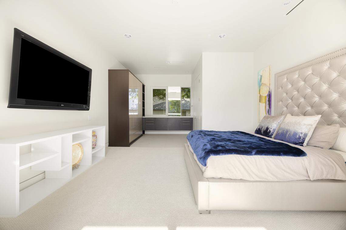 The five-bedroom, 5.5-bath residence offers 7,866 square feet of sleek living space, including a private primary suite with a see-through fireplace, spa-like bathroom with steam shower and jetted tub, and a custom walk-in closet. It’s listed at $5.25 million.