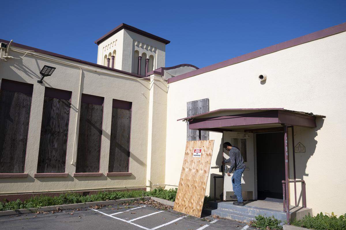 A boarded up door to the Old North Sacramento School is opened earlier this month. 