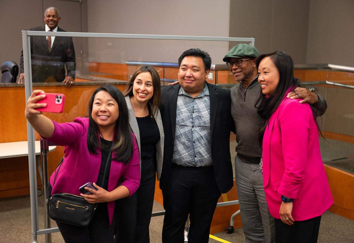Interim District 2 Sacramento City Councilman Shoun Thao, center, poses for a picture taken by sister Gloria Thao with Councilwoman Karina Talamantes, former Councilman Allen Warren and Councilwoman Mai Vang before being sworn-in on Tuesday. Thao worked as a city staffer for Warren.