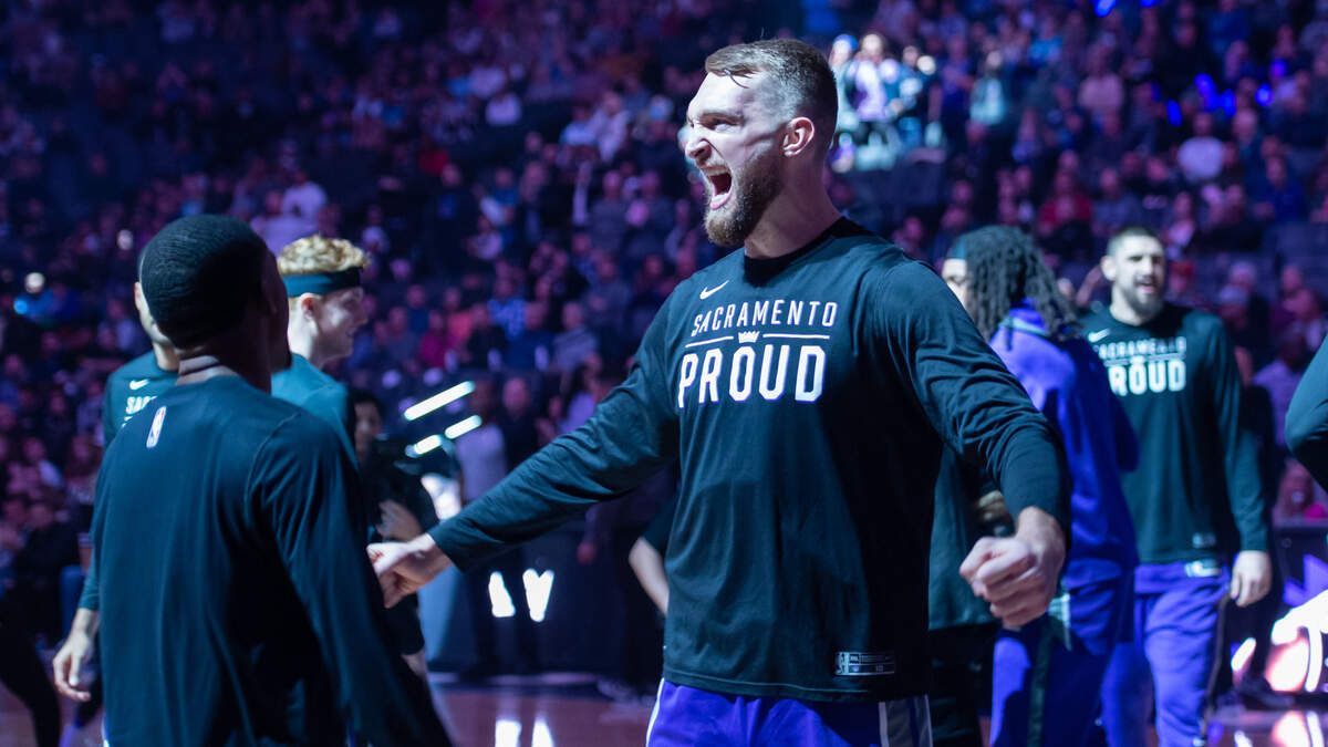 Sacramento Kings guard De’Aaron Fox (5) and forward Domantas Sabonis (10) get pumped up before the game against the Charlotte Hornets on Monday, Dec. 19, 2022, at Golden 1 Center in Sacramento.