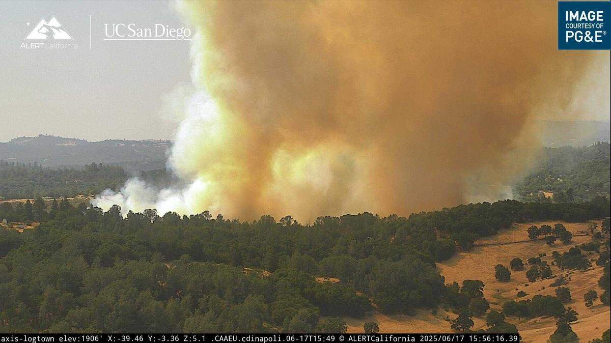The Bonanza Fire is seen burning on the southeastern fringe of the Shingle Springs area in an image taken from a surveillance camera in Logtown. The blaze, which sparked Tuesday, June 17, 2025, has burned at least 25 acres and prompted evacuations to several homes.
