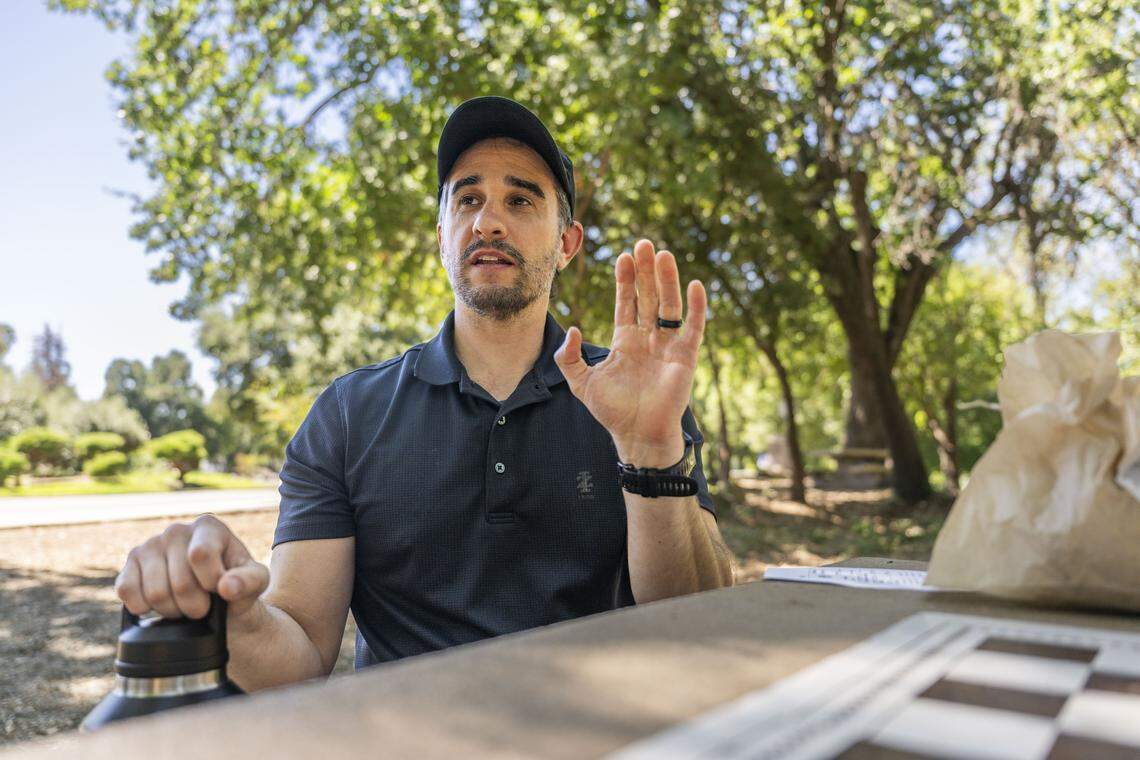 Redding resident Darek Velez, eating his lunch Tuesday at a park picnic bench, shares his opposition to the redistricting proposal. The proposed maps feel like they are taking away rural voters’ freedom of speech, he said.  