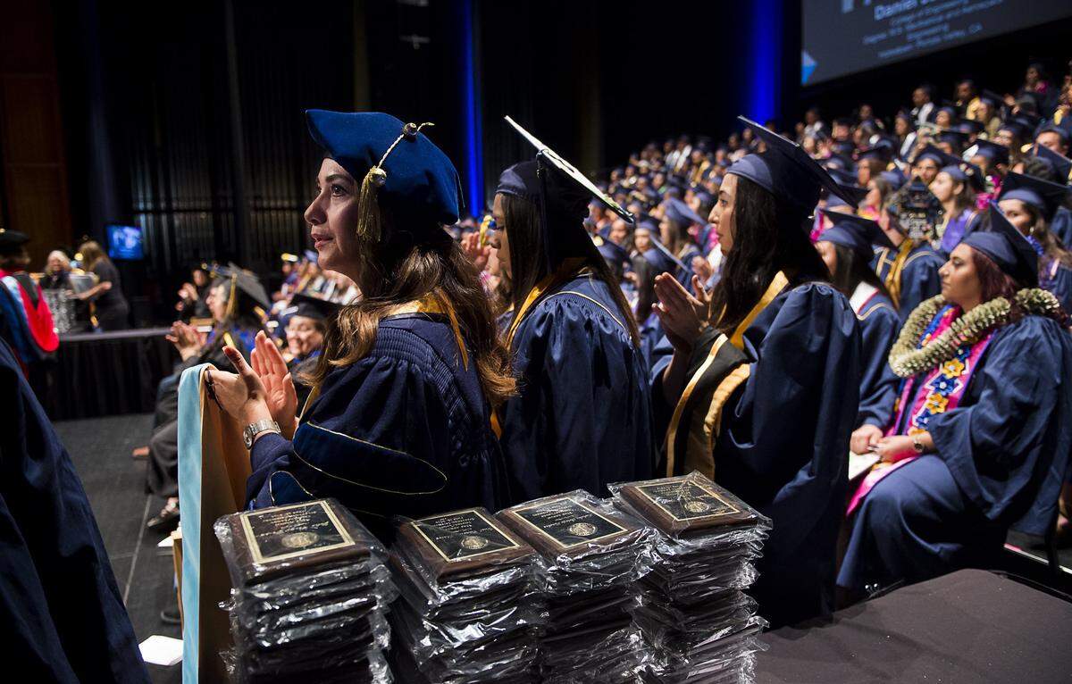 Students wait to receive their honors with during a graduation ceremony at the Mondavi Center at UC Davis in 2016.