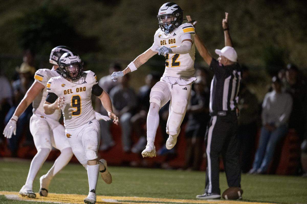 The Del Oro Golden Eagles' Ashton Greenhalgh leaps into the air after scoring a touchdown in the second half against the Placer Hillmen on Friday in Auburn.