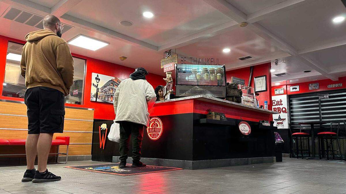 Diners order from the counter at the new Bear West BBQ in Rosemont on Wednesday, Dec. 3, 2025. The restaurant reopened on Folsom Boulevard two months after its original home on Watt Avenue in North Highlands was closed by arson.
