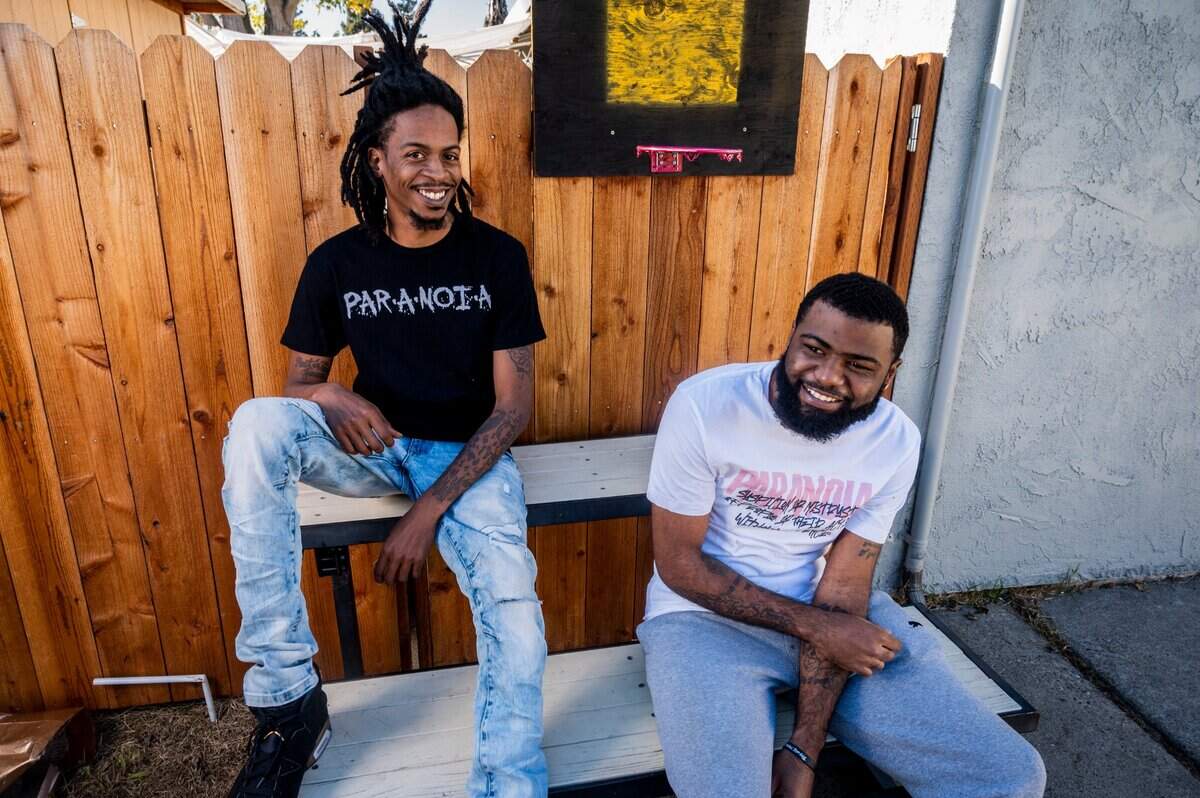 Paranoia clothing brand co-founders Phillip Drakeford, right, and Donald Barrett Jr. are photographed at their home-based internet business at Drakeford’s home in south Sacramento on Wednesday, Nov. 25, 2020. They sell t-shirts and pullover hoodies with their logo on Instagram and their website.
