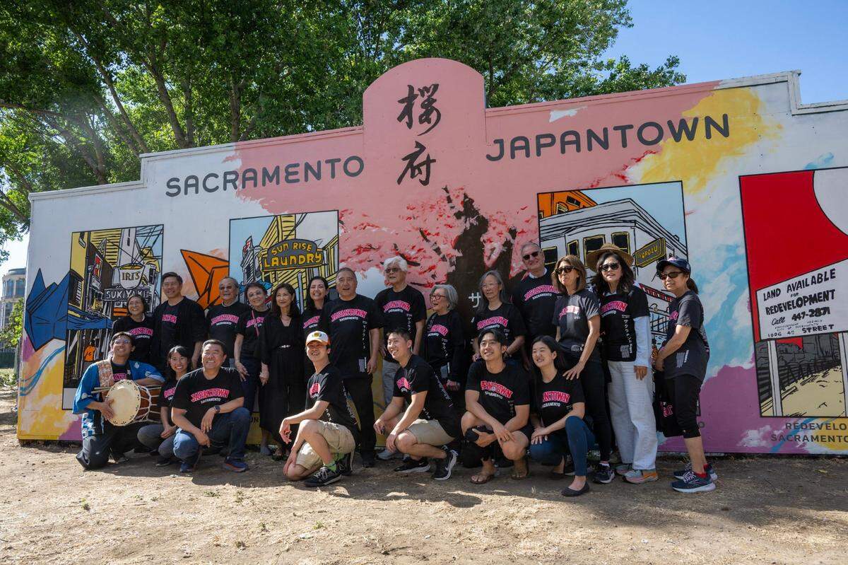 Japanese community members gather in front of a new Sacramento Japantown mural located at Capitol Mall and 4th Street on Wednesday.