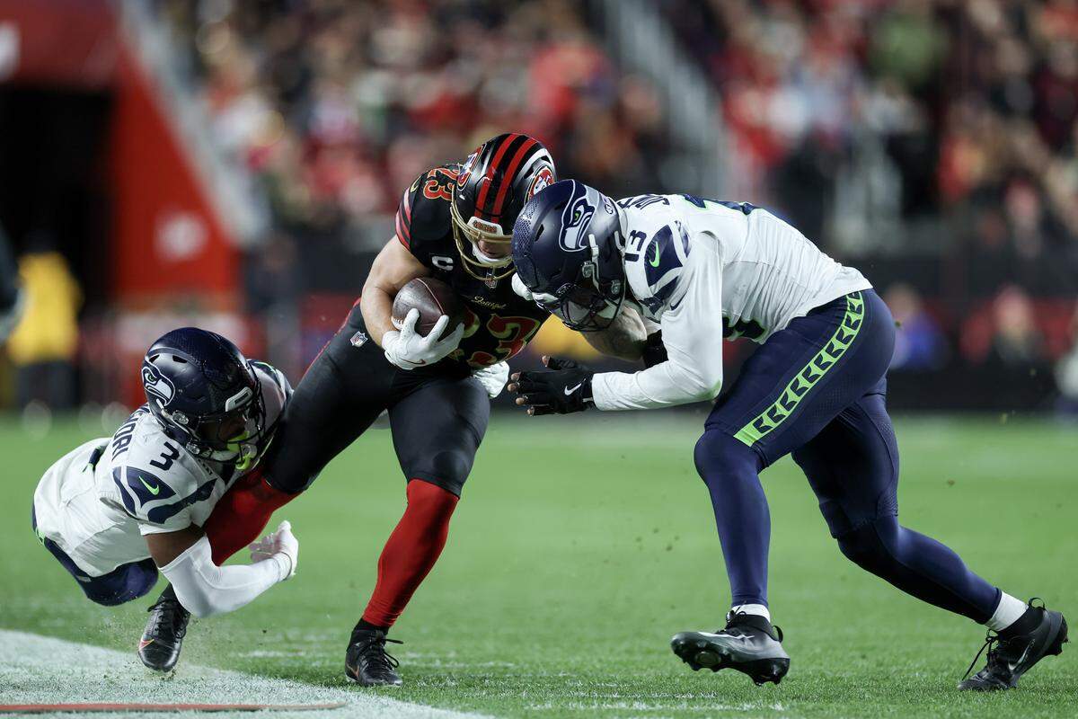 Running back Christian McCaffrey of the San Francisco 49ers carries the ball against the Seattle Seahawks during the second quarter of a game at Levi's Stadium on Saturday, Jan. 3, 2026, in Santa Clara.