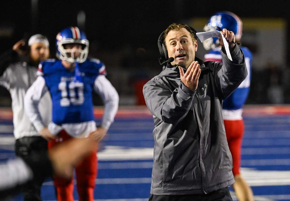 Folsom Bulldogs coach Paul Doherty calls a timeout after running the clock down at the end of the fourth quarter against the Riordan Crusaders In a CIF Northern California Regional Division 1-AA football championship game in Folsom on Dec. 5. He is The Bee’s 2025 Coach of the Year.