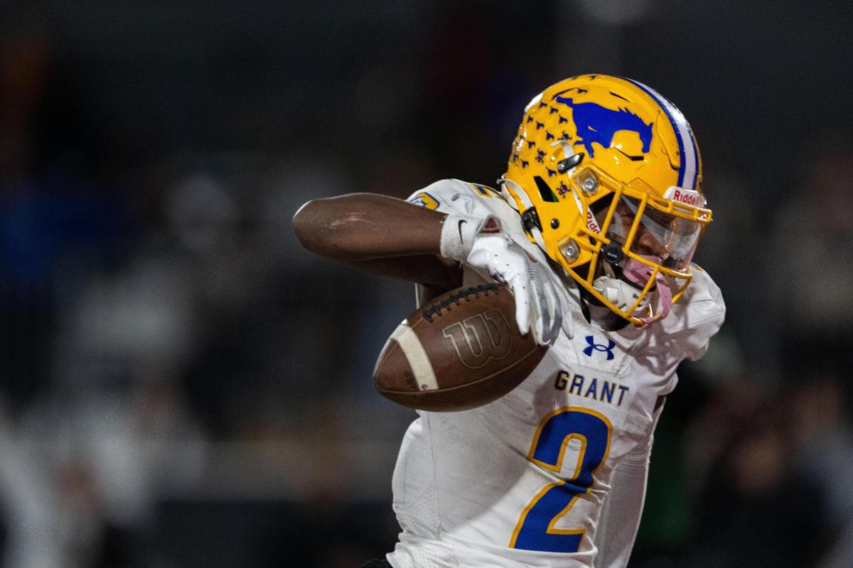 The Grant Pacers’ Koby Shabazz (2) runs for the winning touchdown against Pacifica High School of Oxnard during the CIF State Division 2-AA championship at Saddleback College in Mission Viejo on Friday.