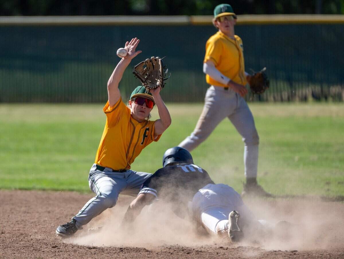 The Casa Roble Rams’ Benjamin Tercero steals second base as Placer Hillmen Jack Addison misses the catch during a CIF Sac-Joaquin Section Division IV baseball semifinal playoff game at Casa Roble High School on Thursday.