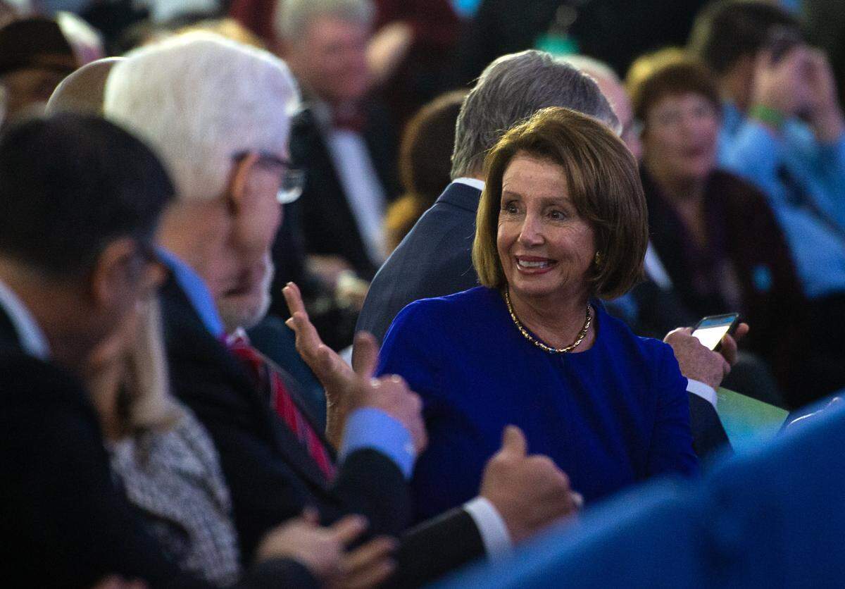 Speaker of the House Nancy Pelosi talks to former governors Arnold Schwarzenegger and Gray Davis during the inauguration of Gavin Newsom at the California Capitol on Monday, Jan. 7, 2019.