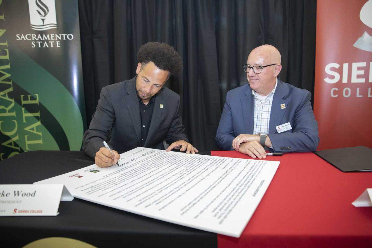 Sacramento State President Luke Wood signs the Presidential Agreement with Sierra College President Willy Duncan to commit to building the Placer Center, a “communiversity” that joins both schools.