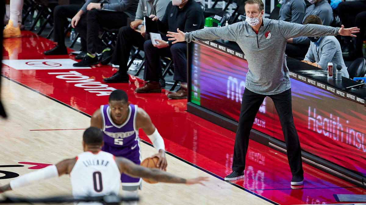 Portland Trail Blazers head coach Terry Stotts, right, gestures during the second half of a preseason NBA basketball game against the Sacramento Kings in Portland, Ore., Sunday, Dec. 13, 2020. (AP Photo/Craig Mitchelldyer)