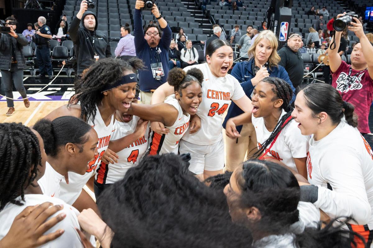 Central Grizzlies celebrate after winning the CIF State Division II Girls Basketball Championships Bonita Vista Barons on Saturday, March 11, 2023, at Golden 1 Center in Sacramento. The Grizzlies defeated the Barons 52-41.