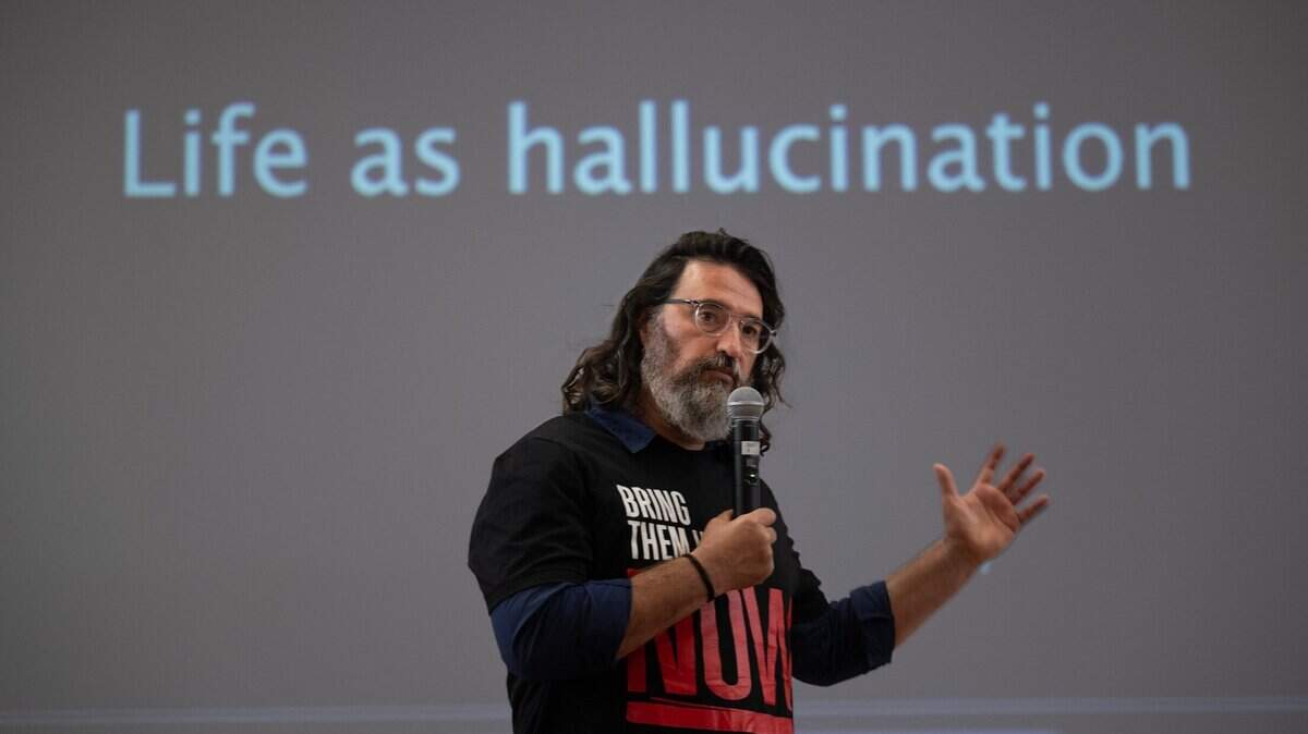 Ilya Tarshansky, a survivor of Oct. 7 Hamas attack on Israel, makes his opening statement about the terrorists that attacked and burnt down his home, murdered his son and kidnapped his daughter before showing a presentation with a message of inspiration, courage, and hope on Thursday at the Folsom Community Center.