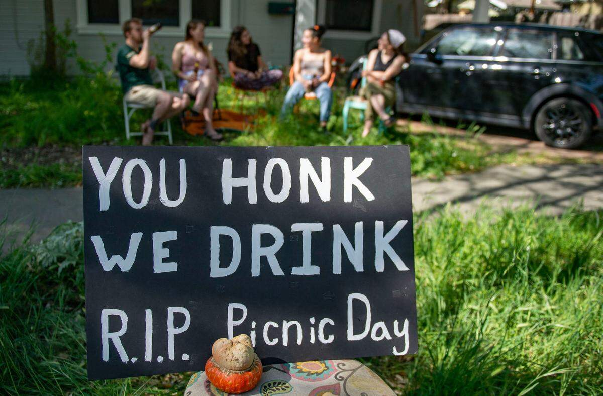 Roommates celebrate Picnic Day with alcohol in their Davis front yard in 2020, when the on-campus celebration was canceled because of the coronavirus pandemic.&nbsp;Off-campus parties have long prompted the city to borrow law enforcement officers from surrounding areas.