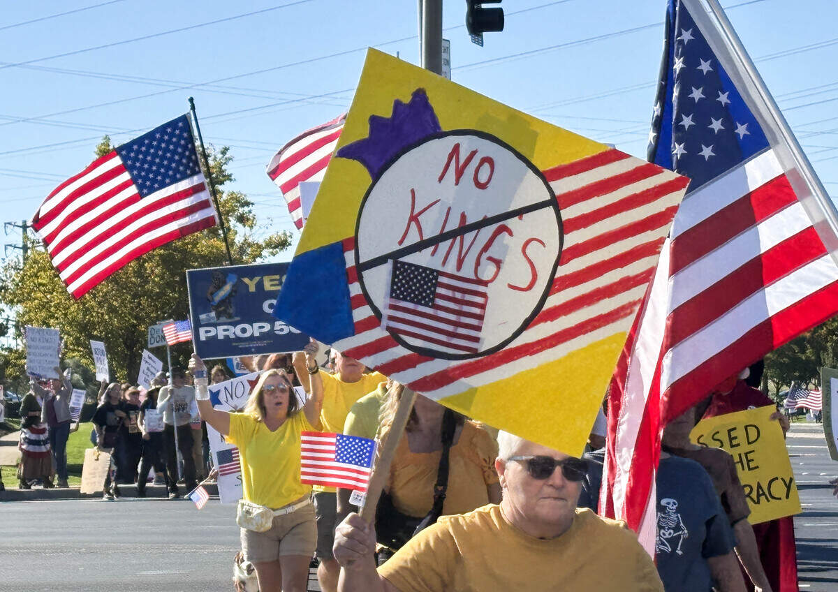 Demonstrators protest the Trump administration during a “No Kings” protest in Roseville on Saturday, Oct. 18, 2025.