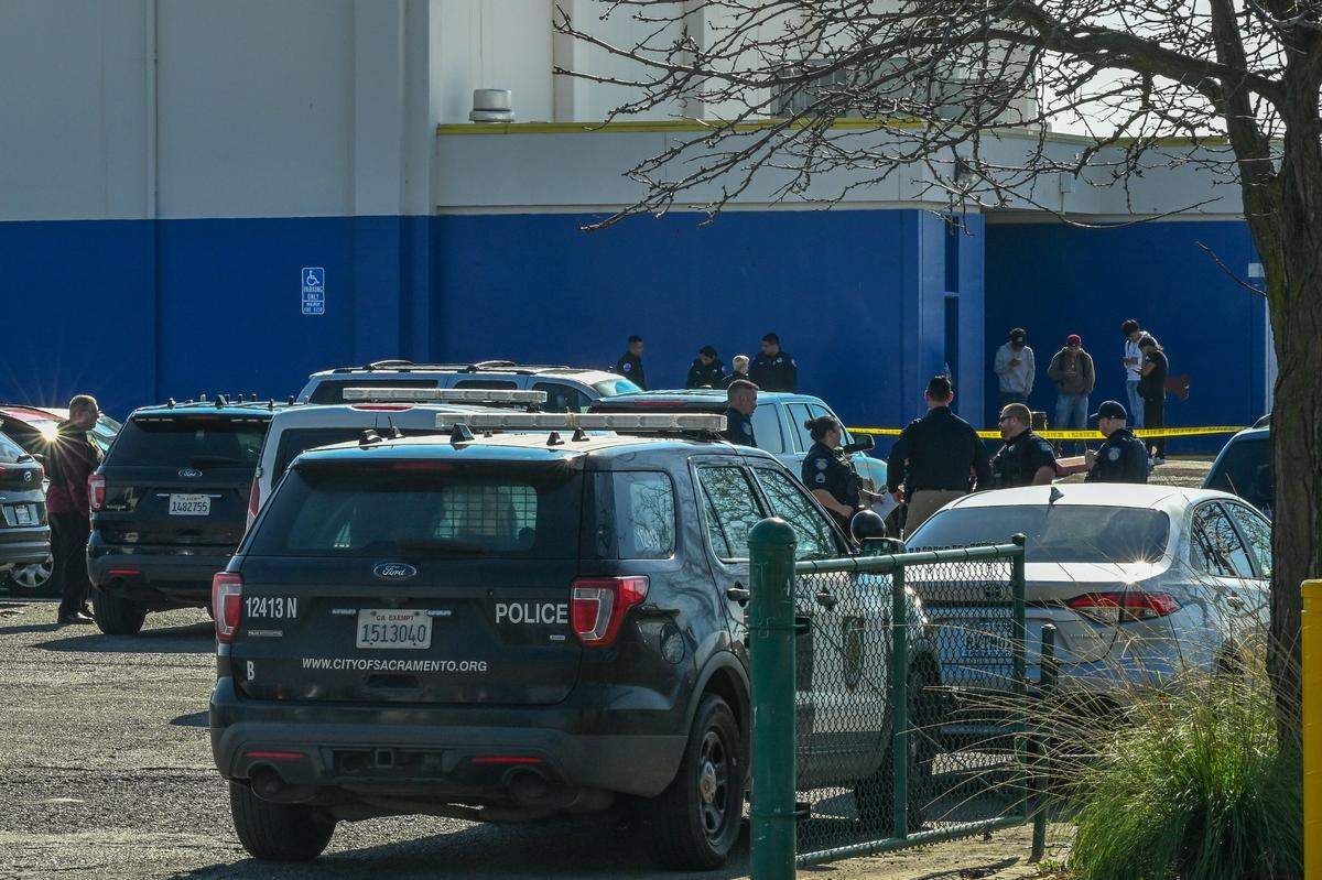 Sacramento Police investigate the scene where a student was shot in the arm at Grant High School on Tuesday.