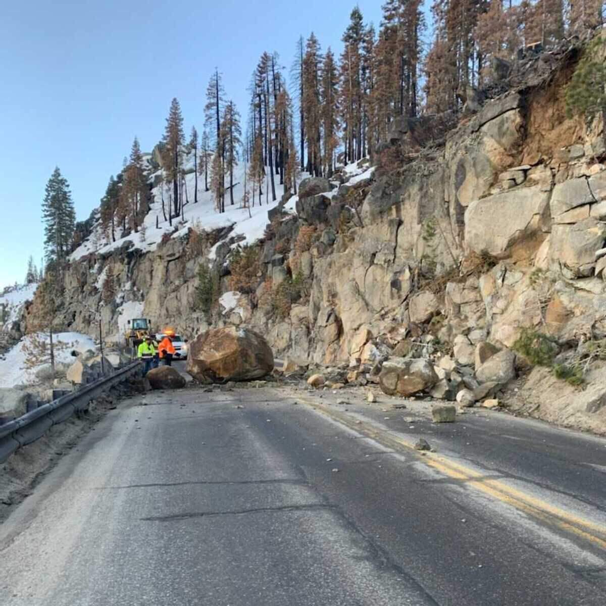 A large boulder fell off of Echo Summit Wednesday March 16, 2022, morning onto the Highway 50 mountain pass in El Dorado County, blocking traffic in both directions.