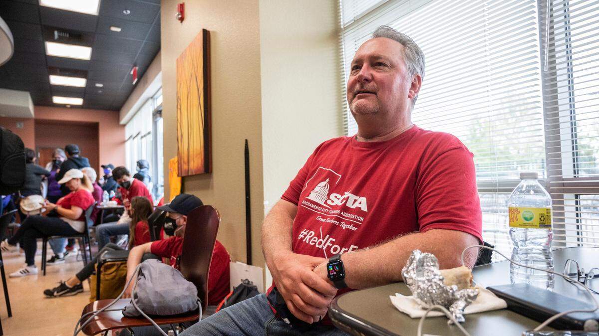 Sacramento City Teachers Association President David Fisher waits for a meeting to bargain with Sacramento City Unified School District negotiators after teachers and school employees marched into the Serna Center on Wednesday.