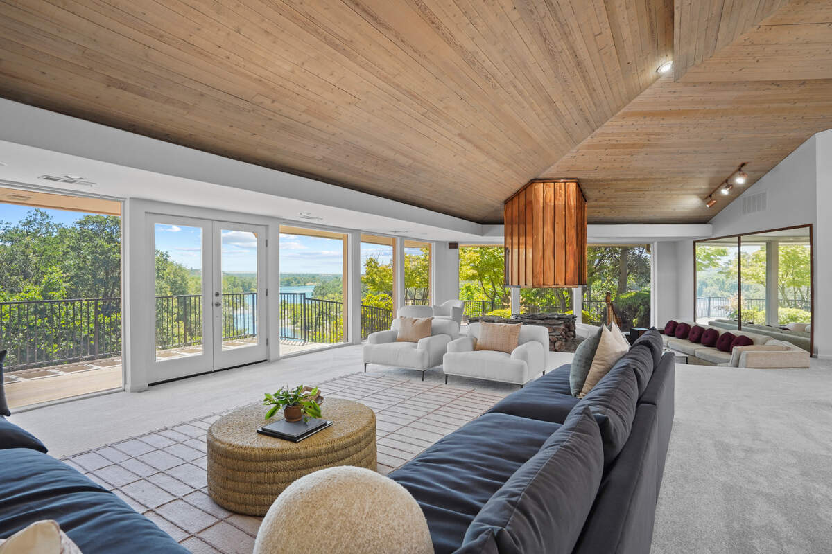 The great room seamlessly flows from kitchen to living room to sunken fireplace room.