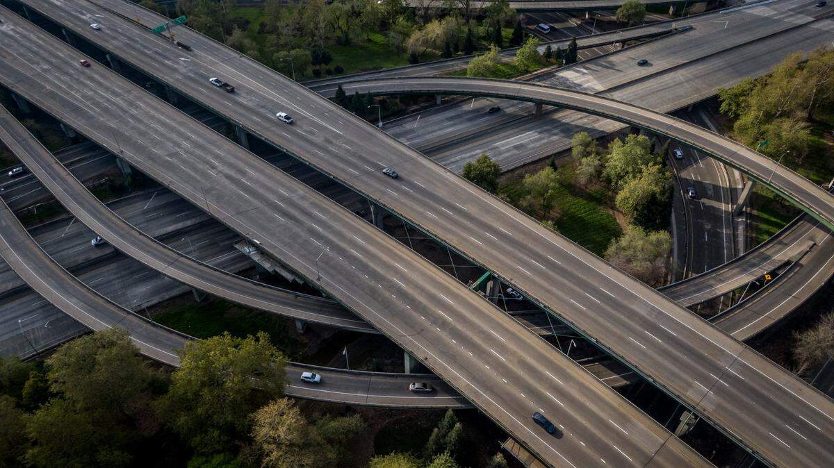 Morning rush hour traffic is light on the Interstate 5-Highway 50 interchange in Sacramento, shown in drone image from March 23, 2020, the first Monday after Gov. Gavin Newsom’s statewide shutdown order to slow the spread of the coronavirus.