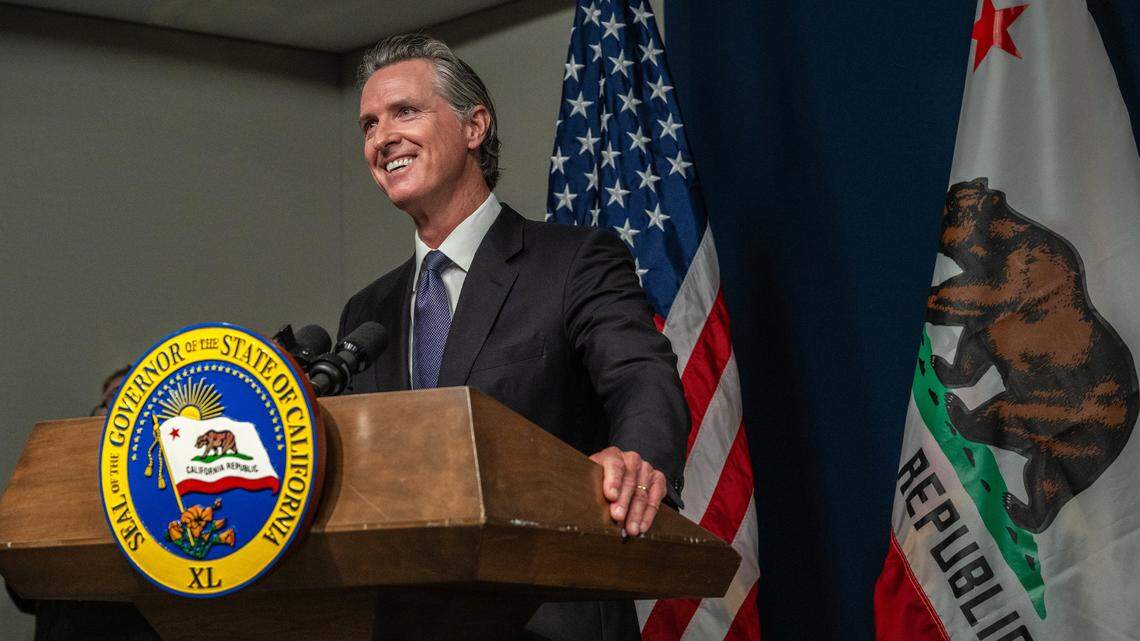 California Gov. Gavin Newsom smiles during a press conference after signing his infrastructure streamlining package on Monday, July 10, 2023, in Sacramento.