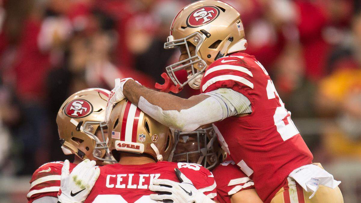 Tight end Garrett Celek (88) is congratulated by his 49ers teammates following his 41-yard touchdown catch in the second quarter against the Seahawks on Sunday, Dec. 16, 2018, at Levi’s Stadium in Santa Clara. Seattle safety Tedric Thompson fell down on the play.