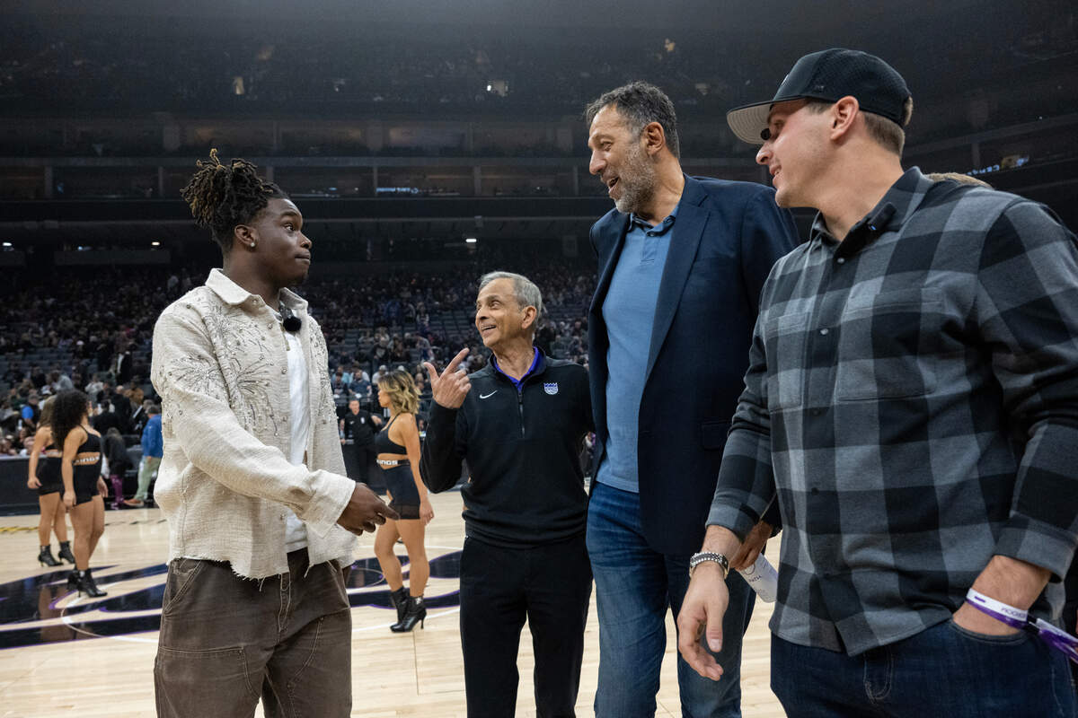 A’s players Lawrence Butler and JJ Bleday talk with Kings owner Vivek Ranadivé and former player/GM Vlade Divac before an NBA game at Golden 1 Center on Monday night.