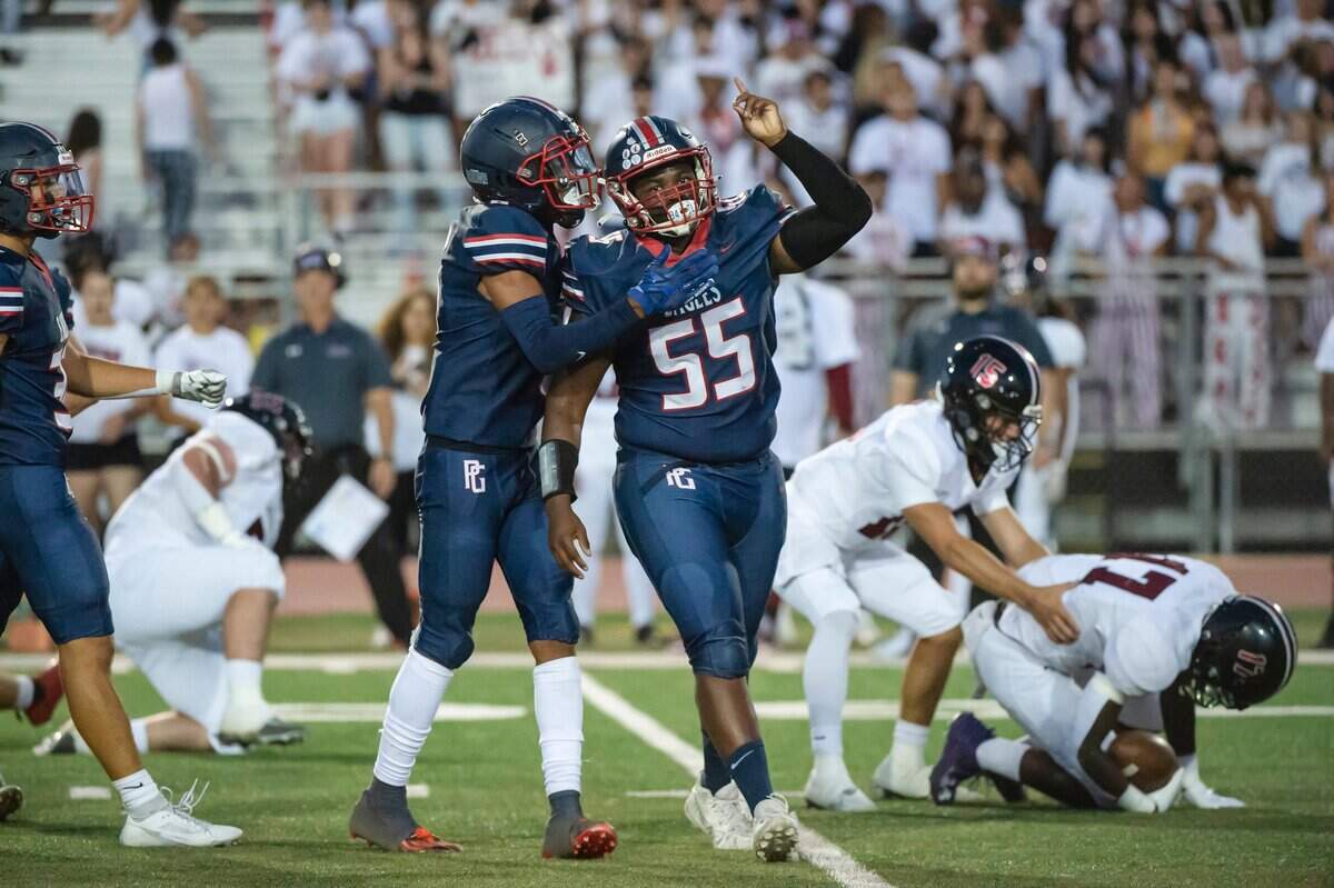 The Pleasant Grove Eagles’ Roman Patterson (55) celebrates after tackling against Laguna Creek in 2023.