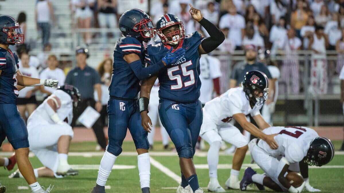 The Pleasant Grove Eagles’ Roman Patterson (55) celebrates after tackling against Laguna Creek in 2023.
