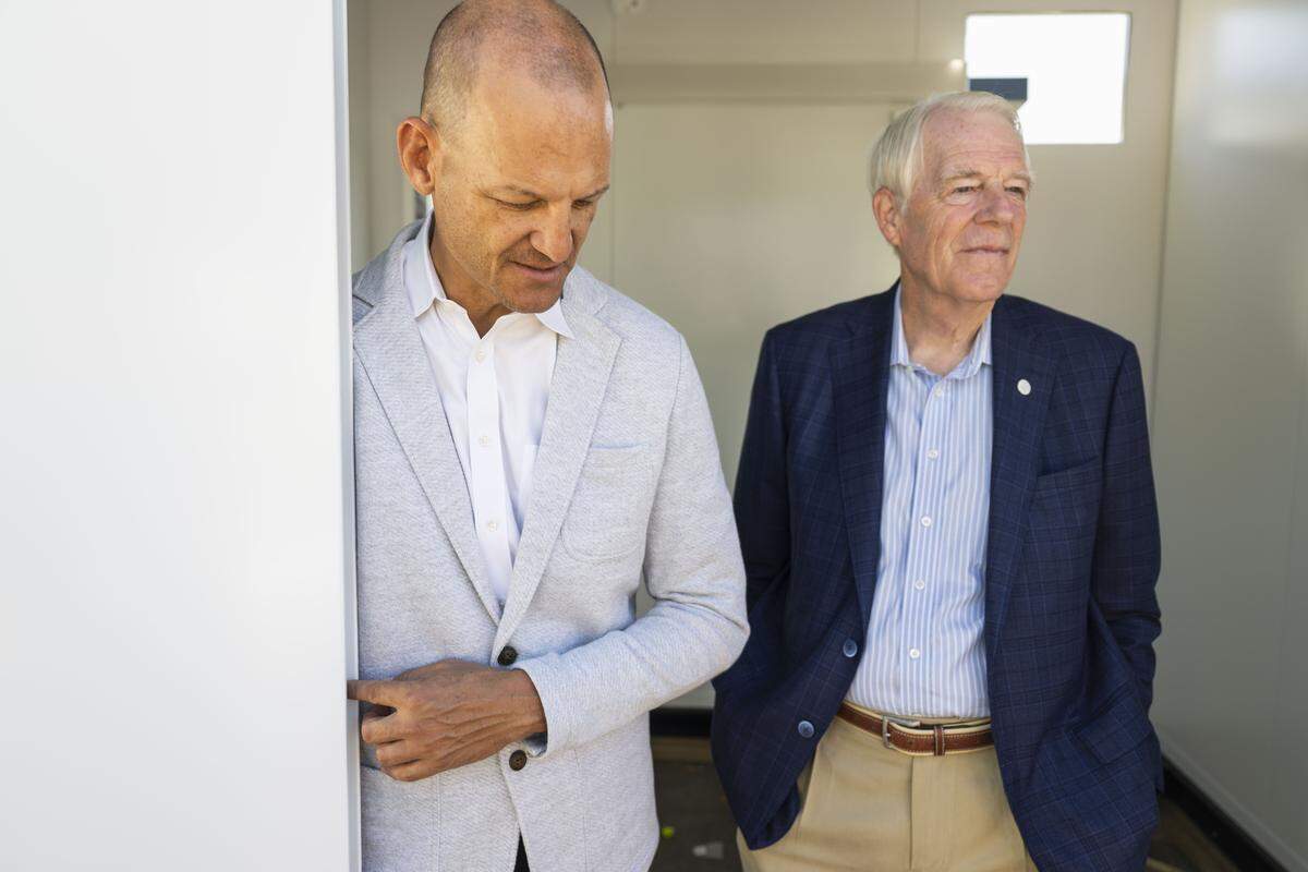Sacramento Mayor Kevin McCarty and Councilmember Roger Dickinson stand inside a tiny home under construction at the City of Sacramento’s Roseville Road Shelter-and-Service Campus on Thursday, Aug. 28, 2025.