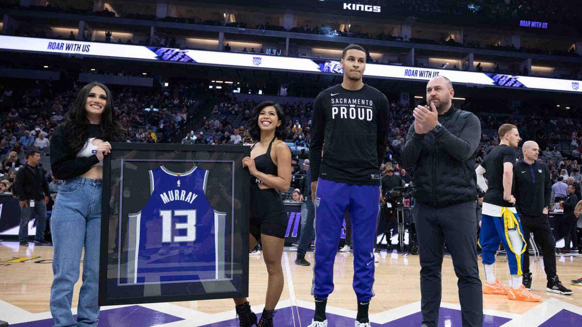 Sacramento Kings forward Keegan Murray (13) is honored before an NBA game between the Sacramento Kings and the Golden State Warriors on Friday, April 7, 2023 at Golden 1 Center.