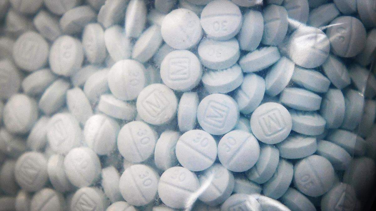 A bag of evidence containing the synthetic opioid fentanyl disguised as Oxycodone is shown during a press conference led by U.S. Attorney McGregor W. Scott at the Fresno County Sheriff’s Office on Wednesday, Aug. 19, 2020 to raise the public’s awareness of the danger of fentanyl as the number of overdose deaths from fentanyl rise.