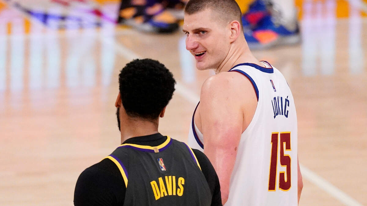 Los Angeles Lakers forward Anthony Davis, left, talks with Denver Nuggets center Nikola Jokic after an NBA basketball game Monday, May 3, 2021, in Los Angeles. (AP Photo/Mark J. Terrill)